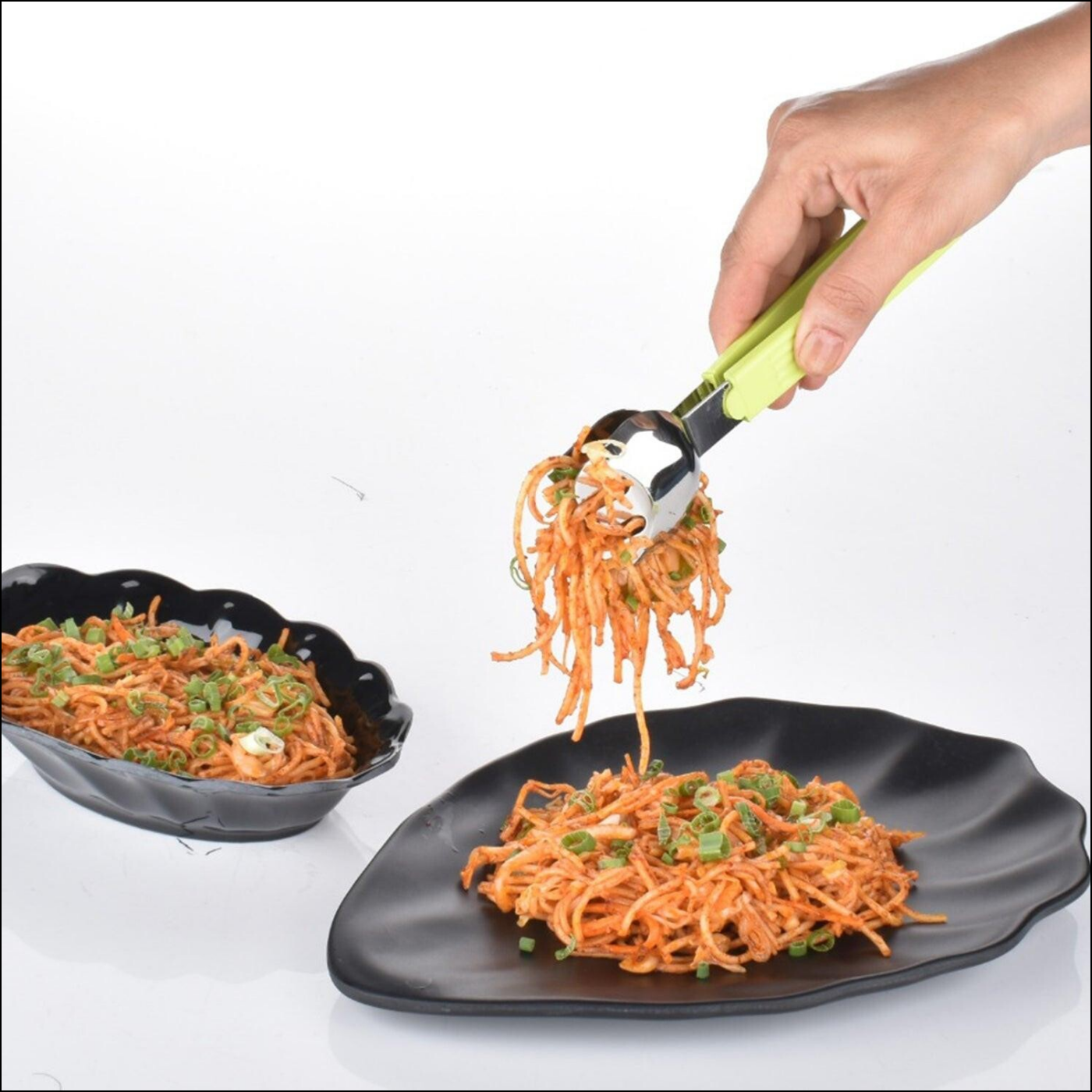 Superior eMart salad serving tongs in use to serve colorful shredded salad from a black plate
