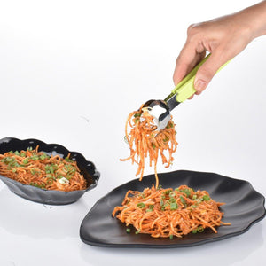 Superior eMart salad serving tongs in use to serve colorful shredded salad from a black plate