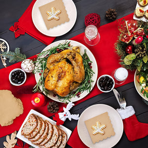 Elegant table setting with scalloped edge disposable napkins and a roast chicken centerpiece