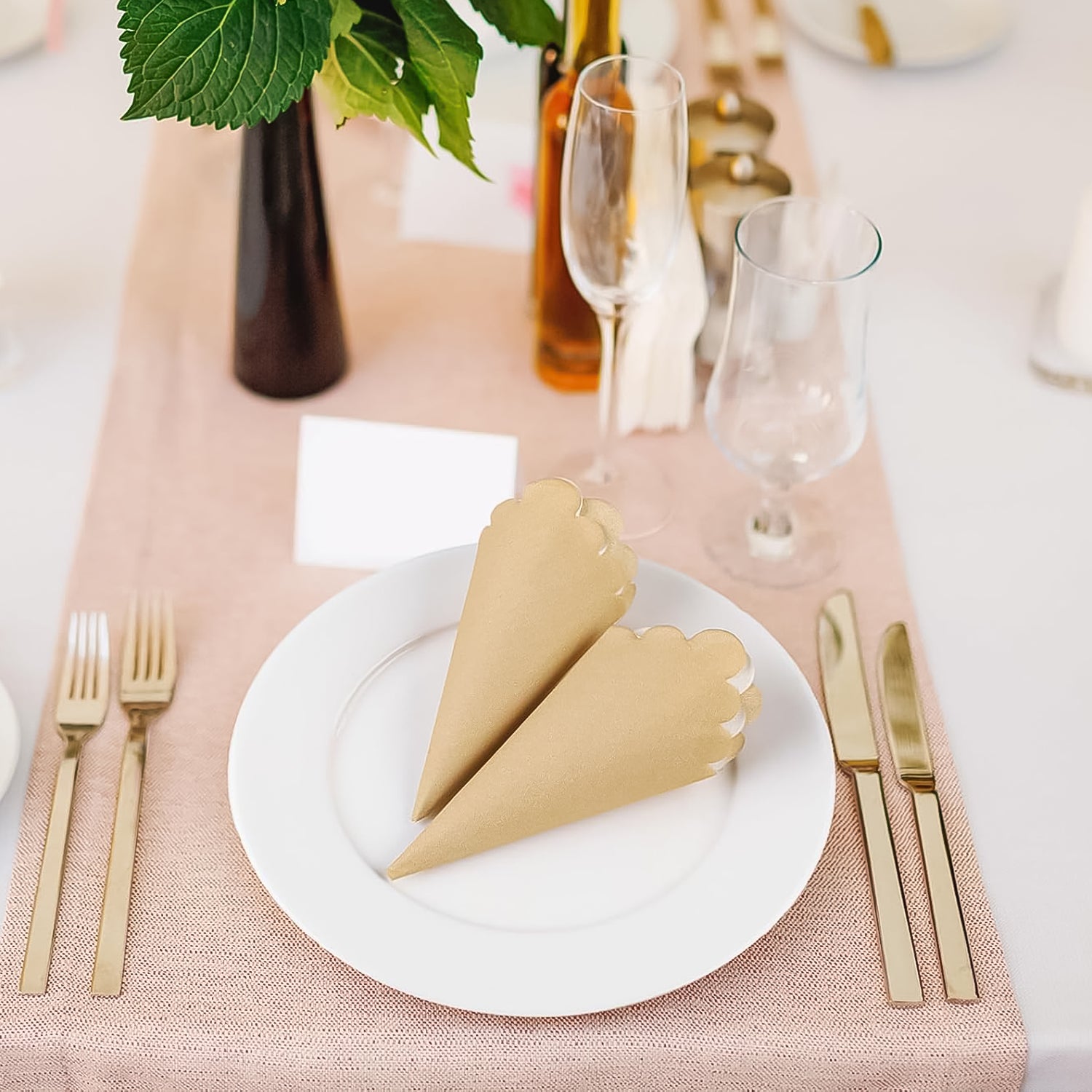 Elegant table setting with scalloped edge disposable napkins on a white plate for special occasions