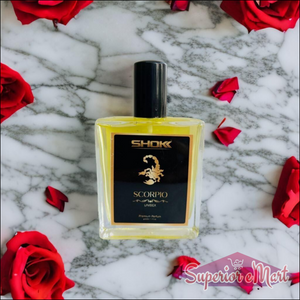 Scorpio Zodiac Unisex Perfume 50ml in a clear bottle surrounded by red rose petals