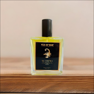 Scorpio Zodiac Unisex Perfume 50ml in a sleek bottle with a stylish design on a wooden surface