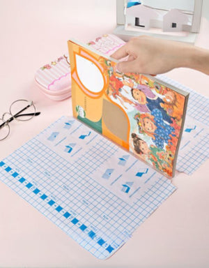 Hand applying self-adhesive transparent protective book cover on a colorful children's book