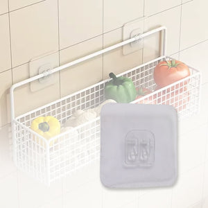 Self adhesive wall hooks holding a wire basket filled with vegetables for convenient kitchen storage