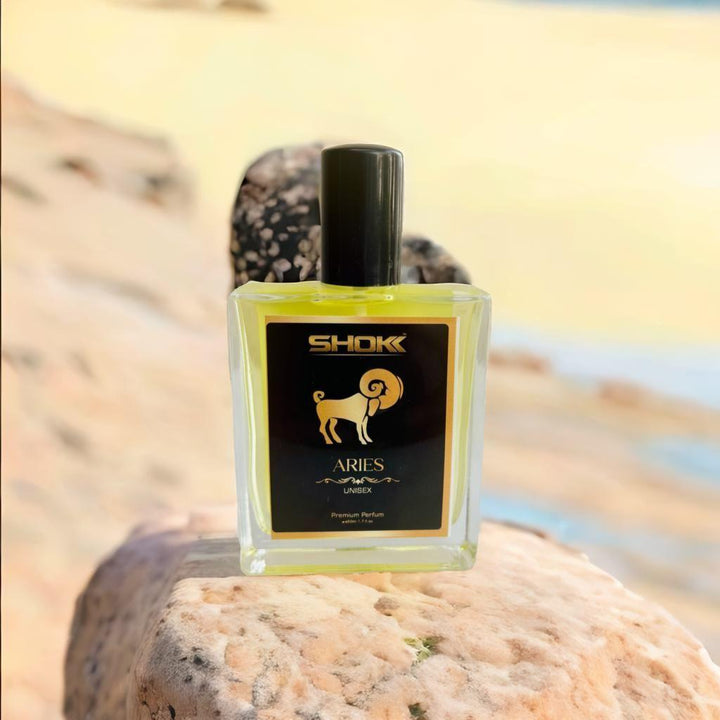 Aries Zodiac Unisex Perfume 50ml in a stylish bottle with an elegant design on a natural stone surface