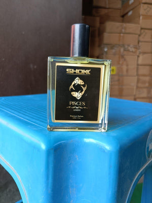 Pisces zodiac unisex perfume 50ml in a sleek bottle with a black label featuring a golden design