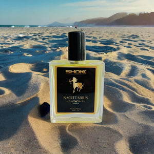 Sagittarius Zodiac Unisex Perfum 50ml by Superior eMart displayed on sandy beach with clear sky background