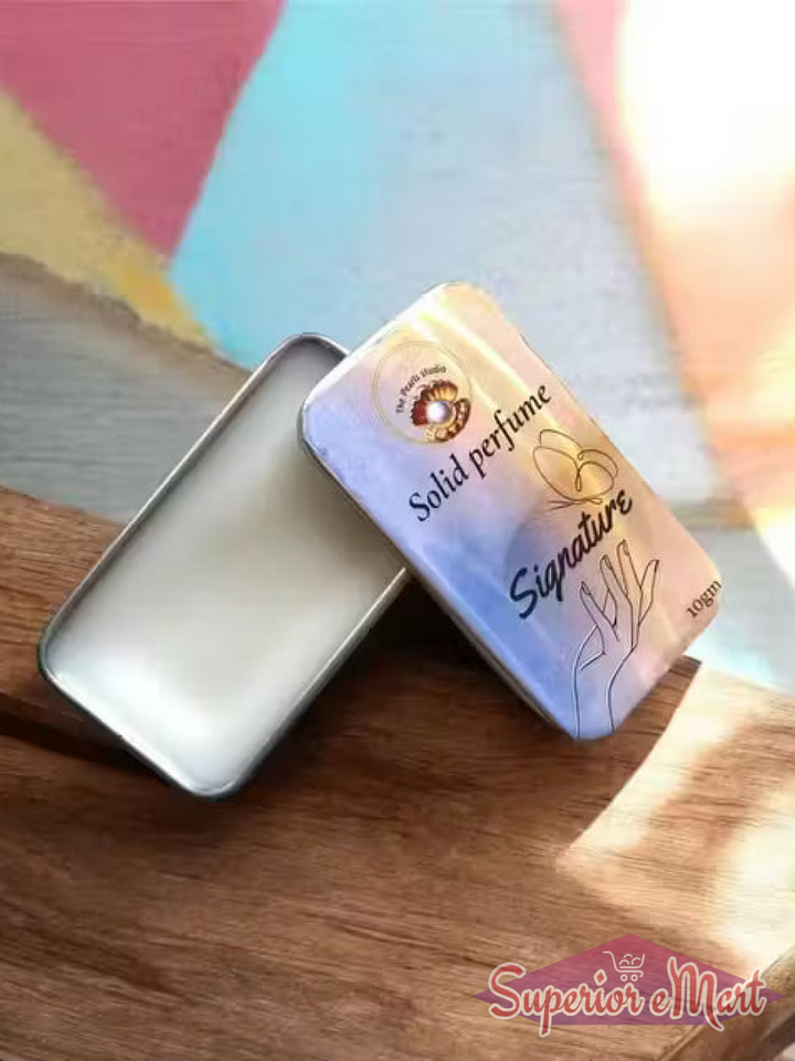 Solid perfume packaging with 'Signature' branding on a wooden surface