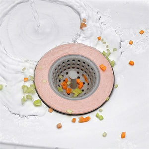 Silicon sink strainer with a round design catching vegetable scraps and food debris in a kitchen sink