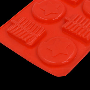Silicone chocolate mold tray in red featuring star and bar shapes for easy chocolate creation