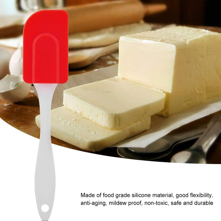 Silicone Cooking Spatula 1 Pc-18 Cm in red, ideal for spreading and scraping butter on a cutting board