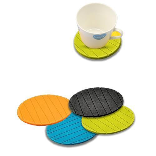 Silicone cup mat coaster set in four vibrant colors with a cup on one coaster