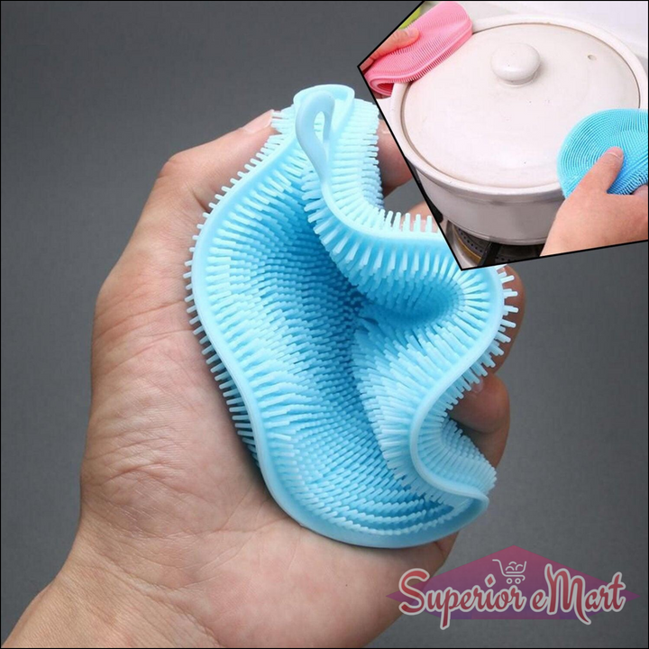 Light blue silicone dish scrubber sponge with textured surface for effective cleaning in hand