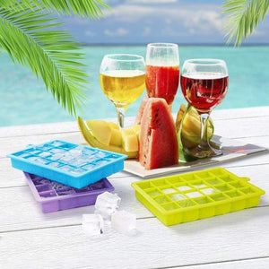 Colorful silicone ice cube trays with lid in blue, green, and purple for making ice cubes easily