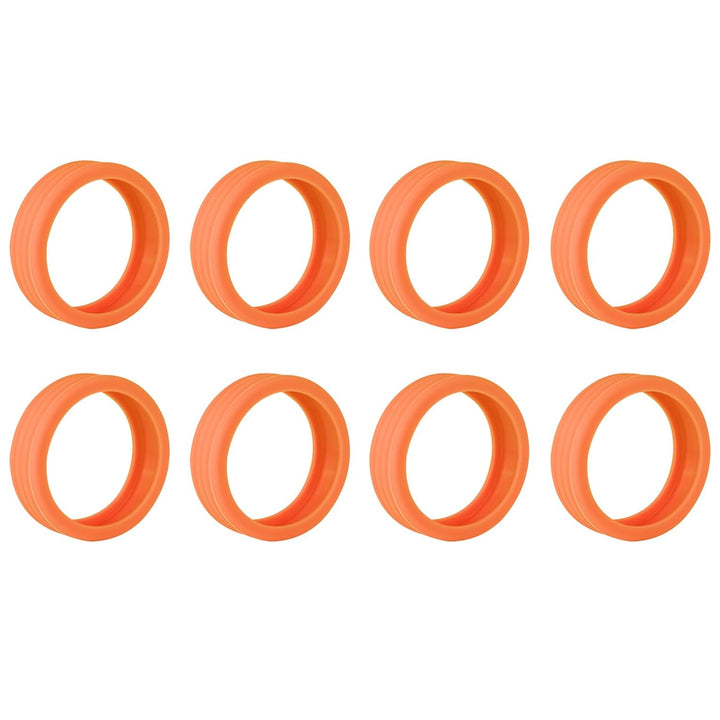 Set of eight orange silicone luggage wheel covers for protecting suitcase wheels during travel