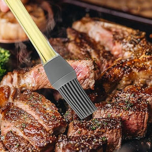 Silicone oil brush for cooking, applying oil on grilled meat for perfect flavor and moisture.