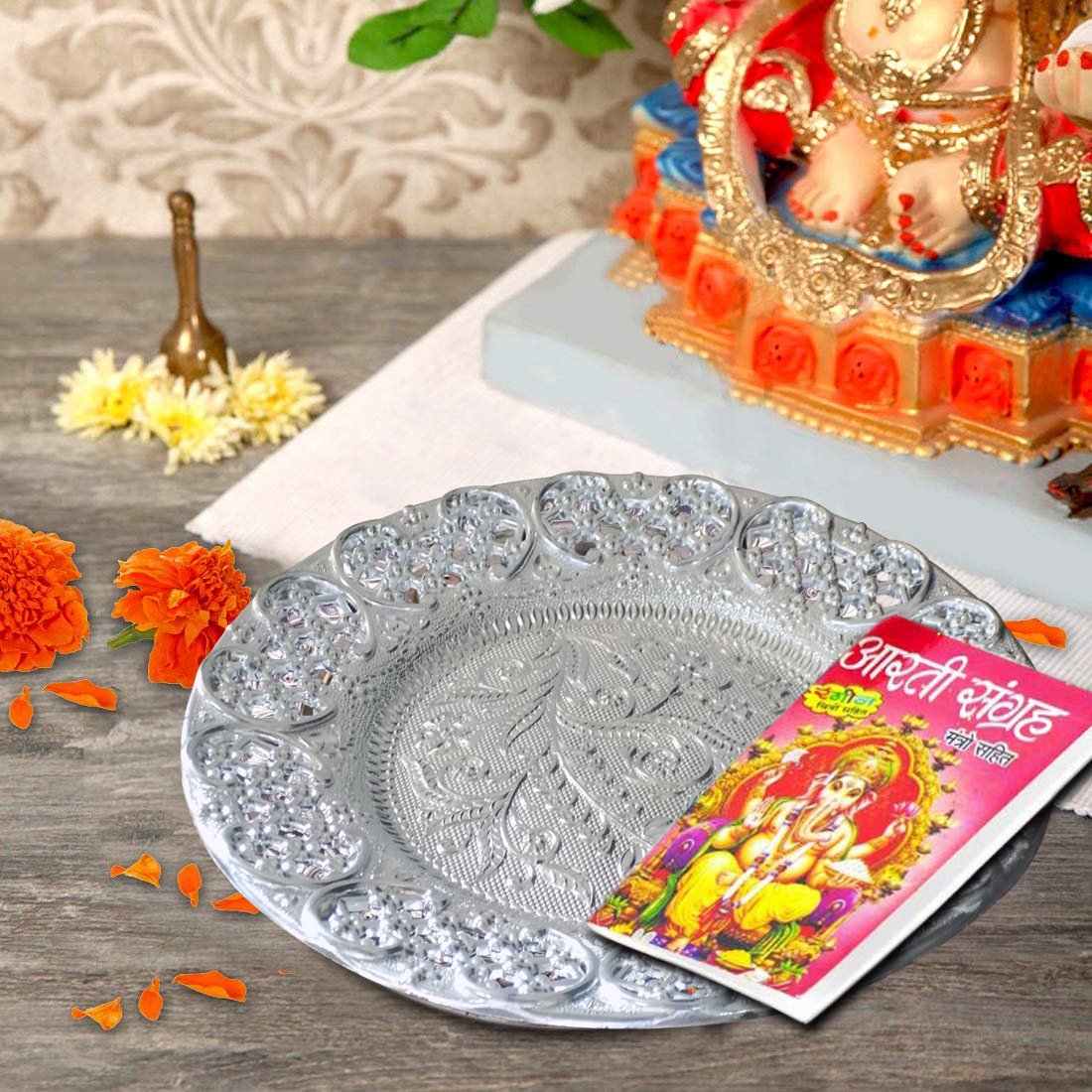 Elegant silver plated pooja thali with intricate design, perfect for religious ceremonies and home decor