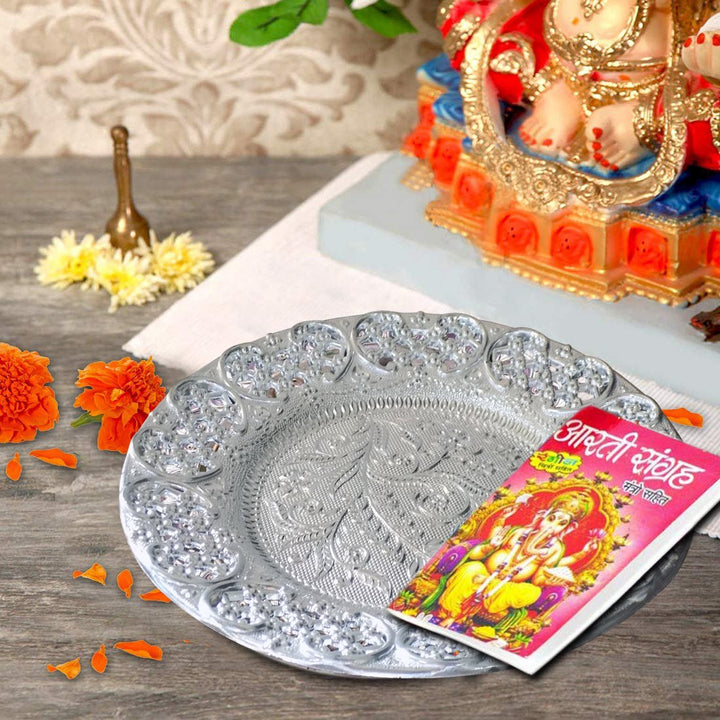 Elegant silver plated pooja thali with intricate design, perfect for religious ceremonies and home decor