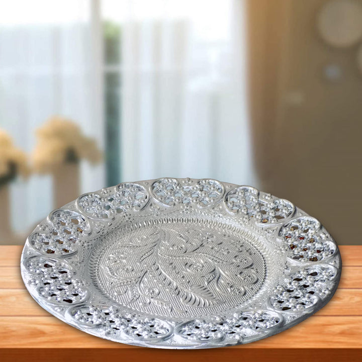 Elegant silver plated pooja thali with intricate designs for traditional ceremonies and home decor