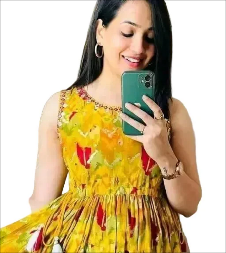 Sleeveless kurti with yellow printed embroidery.