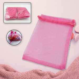Small organza gift bags in vibrant pink, perfect for party favors and special occasions