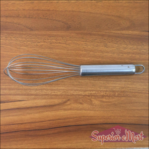 Small stainless steel balloon whisk with a sleek handle, ideal for beatings eggs and mixing ingredients
