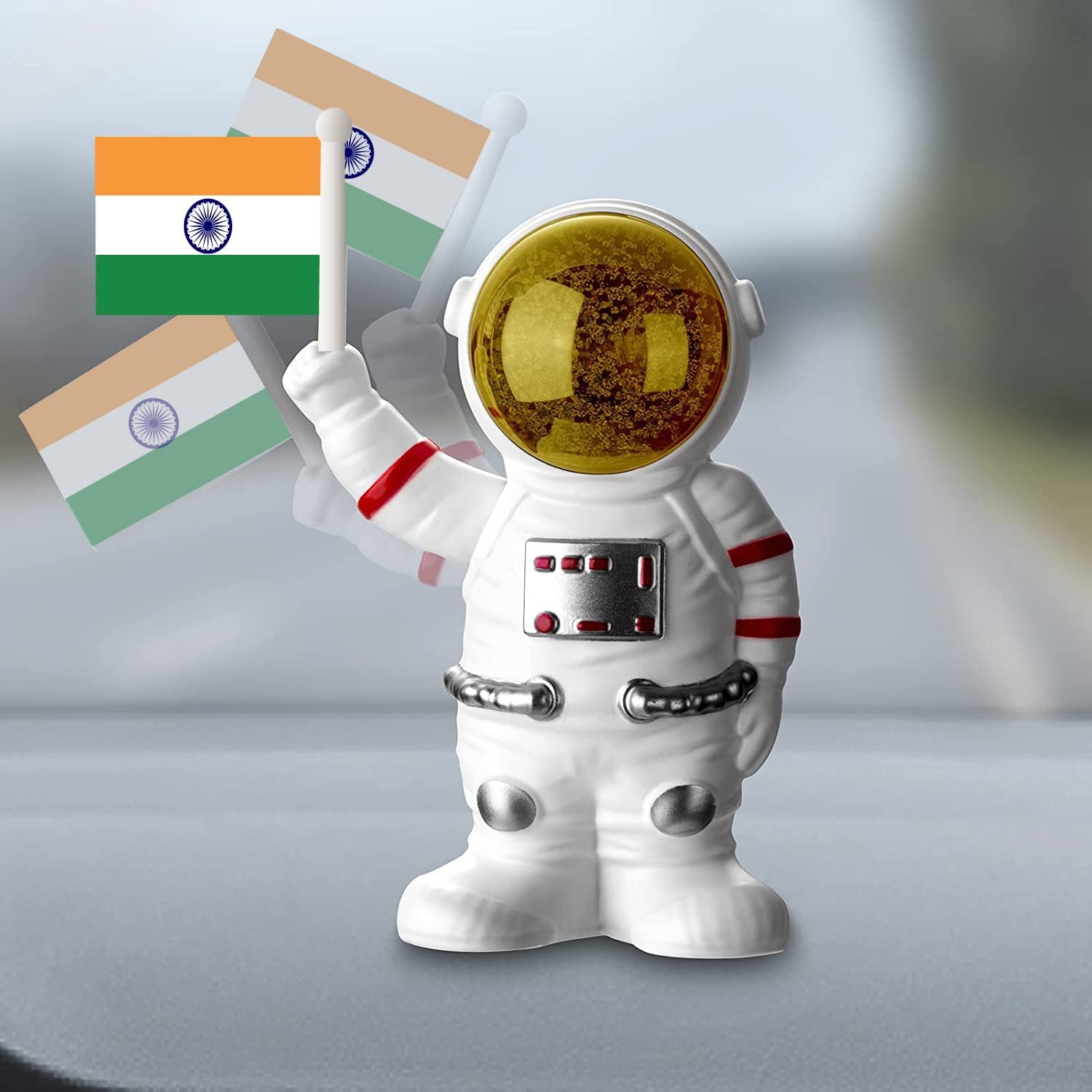 Solar power astronaut ornament holding Indian flags, perfect for home decor enthusiasts