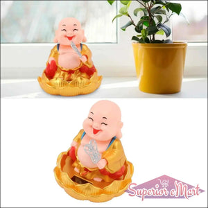 Decorative solar powered Buddha statue with a joyful expression, seated on a lotus flower base
