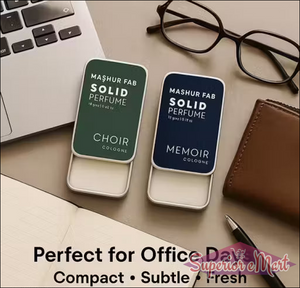 Mashur Fab solid perfume tins in green (Choir) and navy (Memoir) with sliding lids on a desk with office essentials.