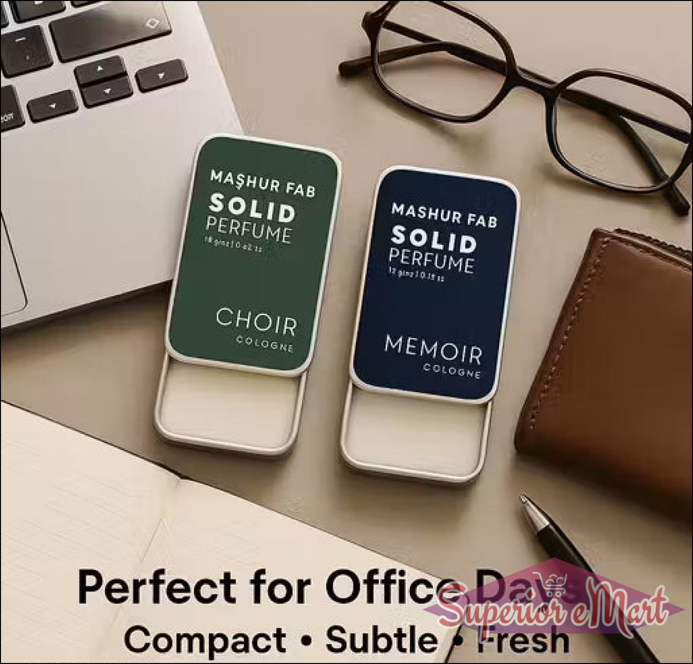 Mashur Fab solid perfume tins in green (Choir) and navy (Memoir) with sliding lids on a desk with office essentials.