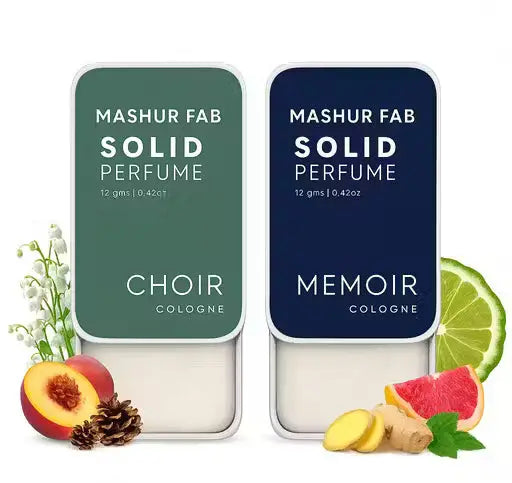 Mashur Fab 12g solid perfume: Green 'Choir' and blue 'Memoir' metal tins with fruit, flower, and spice scent graphics.