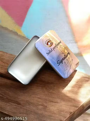 Open tin of Superior eMart solid fruit perfume for men and women on a wooden surface