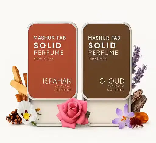 Mashur Fab Solid Perfume: orange Ispahan and brown G Oud sliding metal tins with floral and wood ingredients.
