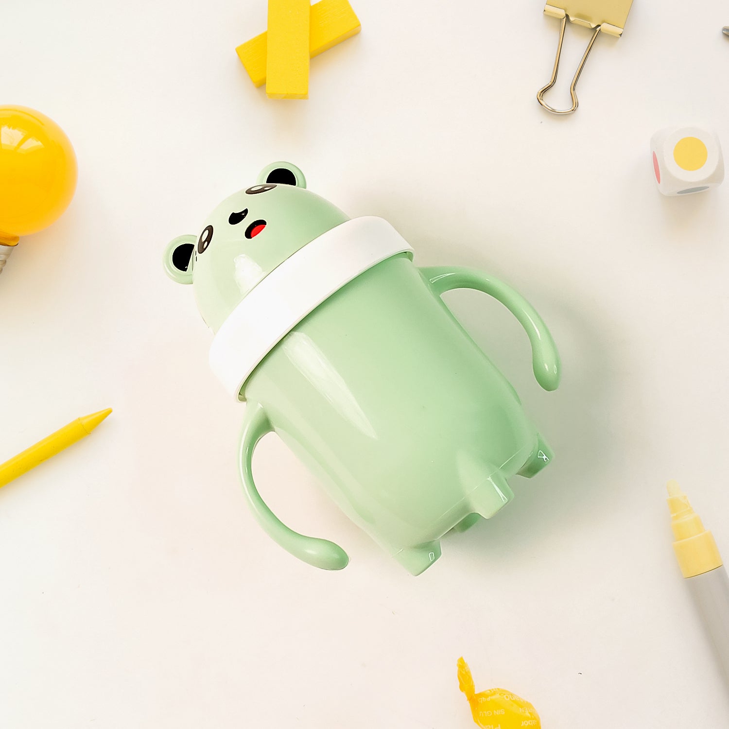 Cute green bear-shaped spill proof baby sipper cup with easy-grip handles for toddlers