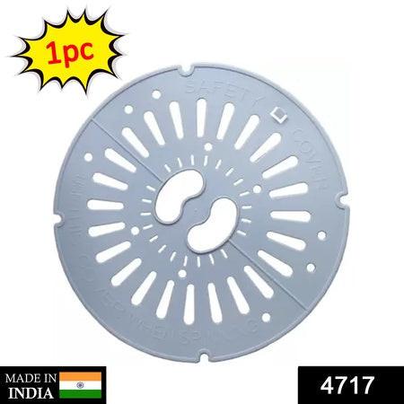 Spin cap safety cover in gray, designed to protect against spills and ensure safety in home kitchens