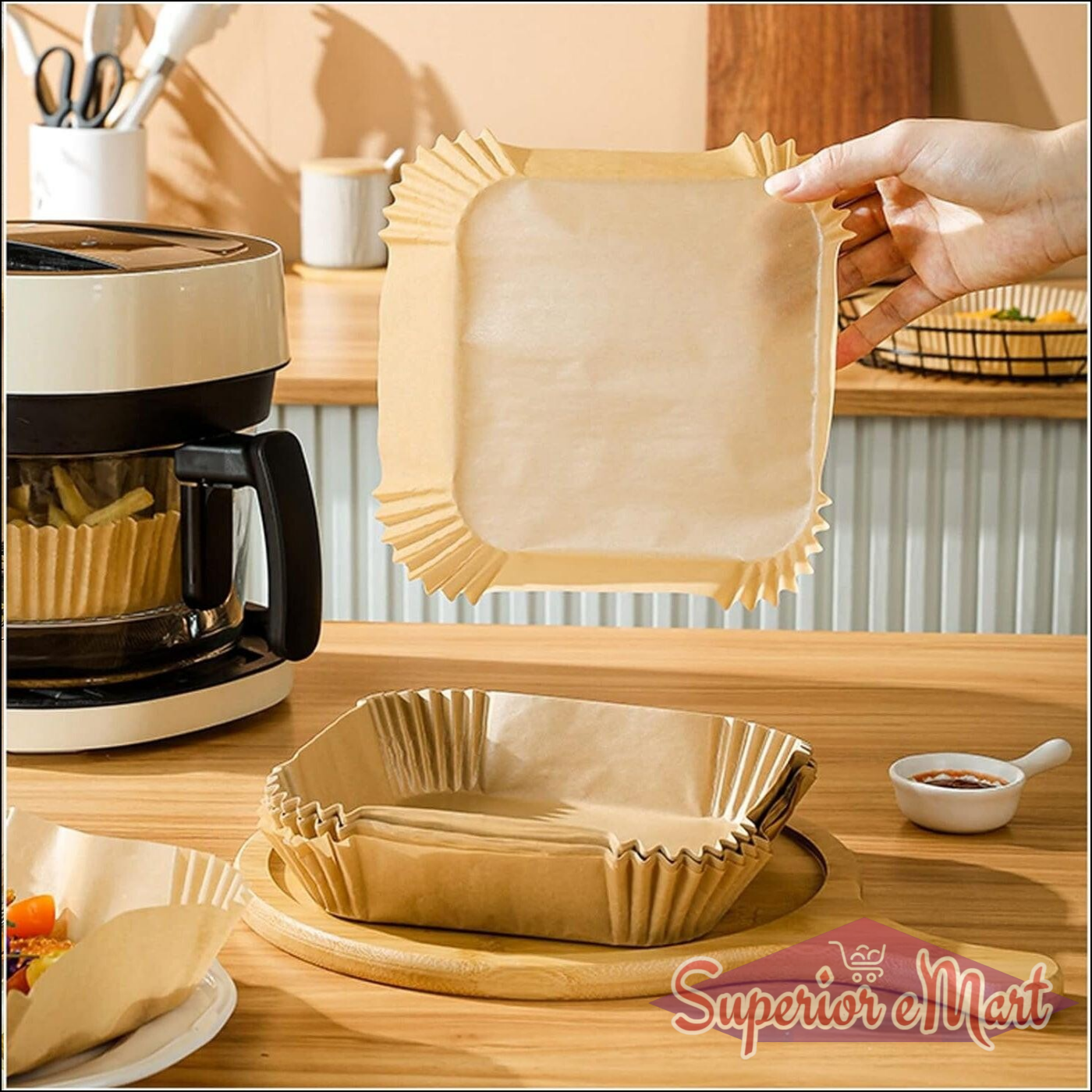 Square air fryer liner disposable in hand, perfect for easy cleanup and cooking without mess