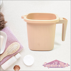 BPA free bath mug in soft beige color with a comfortable handle for easy use