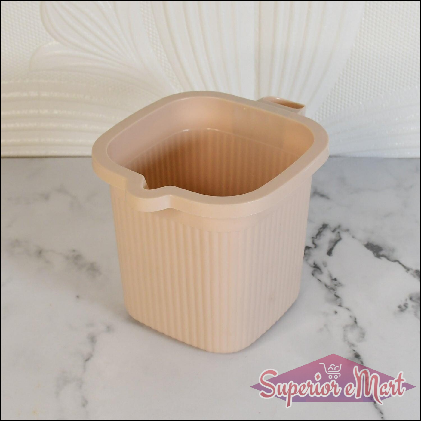 BPA free bath mug in soft pink color with ribbed texture and convenient handle