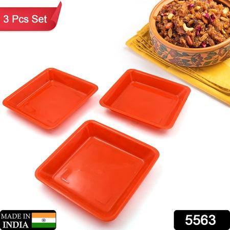 Square dinner plate set in bright orange color made from durable material, perfect for serving meals