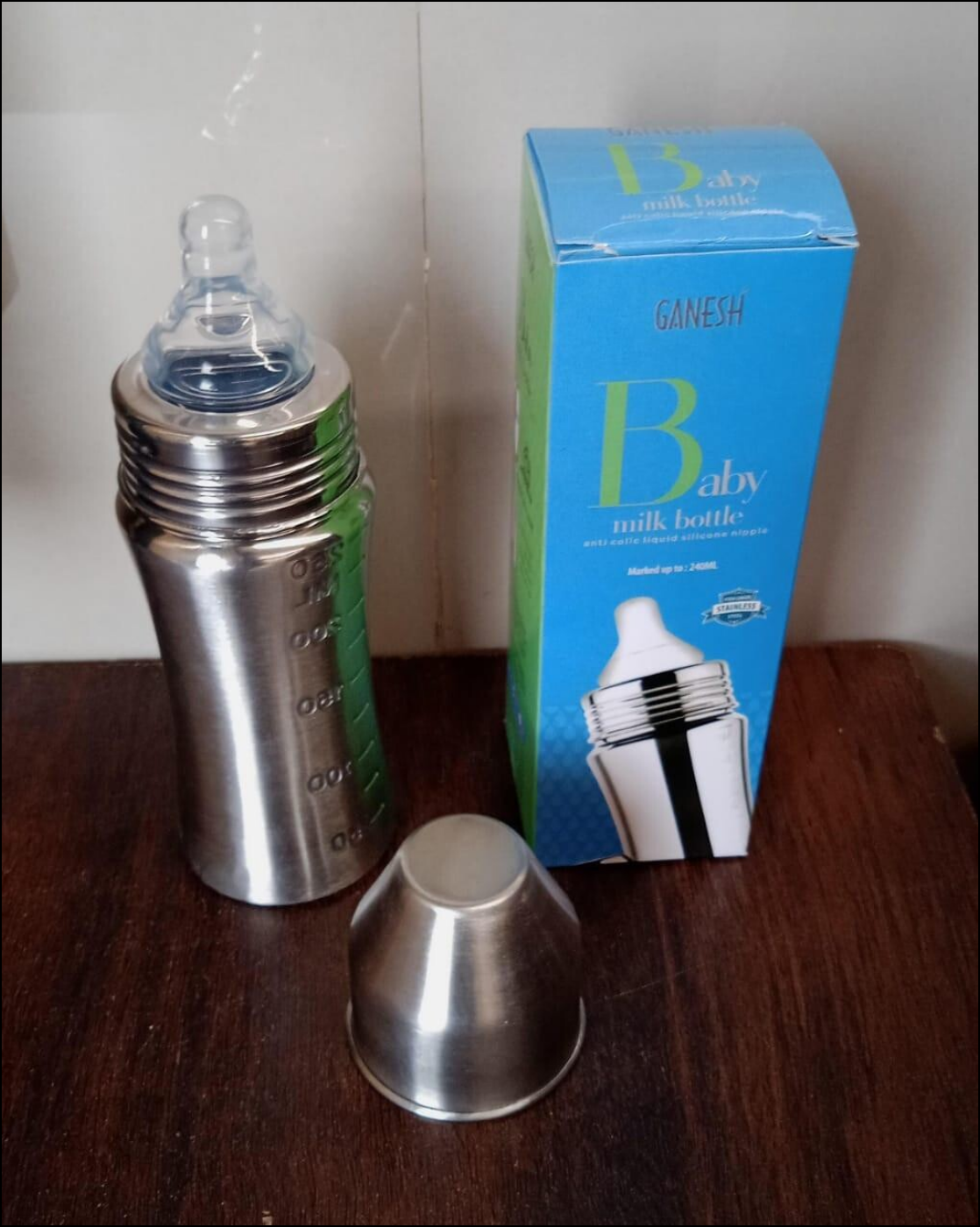 Superior eMart stainless steel baby milk bottle with anti-colic design and protective cap