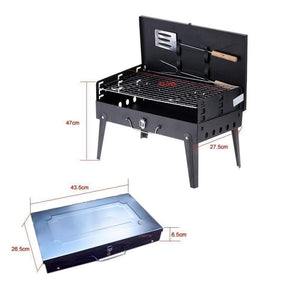 Compact stainless steel barbecue grill with folding design and included grilling tools for outdoor cooking