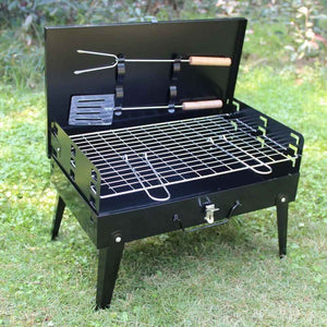 Portable stainless steel barbecue grill with grill tools and a stylish black finish for outdoor cooking