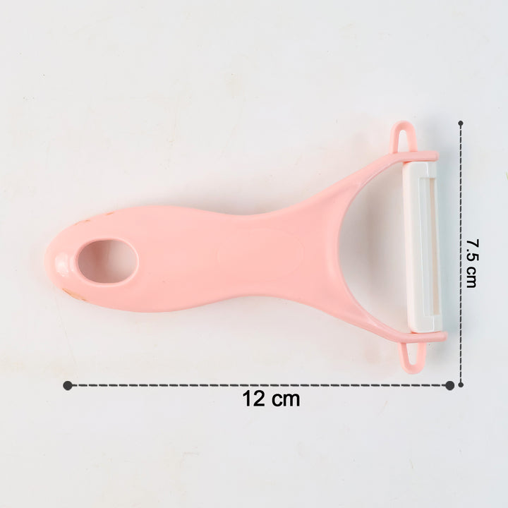 Pink ergonomic vegetable peeler with stainless steel blade for easy peeling and home cooking