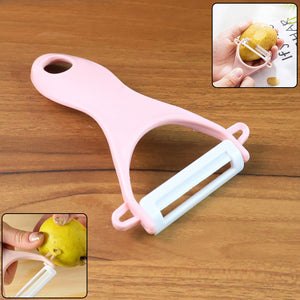 Superior eMart stainless steel blade vegetable peeler in pink for easy peeling of fruits and vegetables