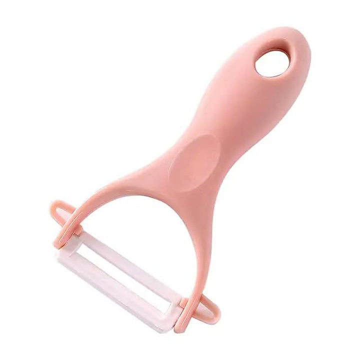 Pink ergonomic vegetable peeler with a stainless steel blade for easy peeling of vegetables