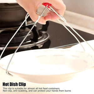 Stainless steel dish gripper tongs in use for safely handling hot food containers in the kitchen