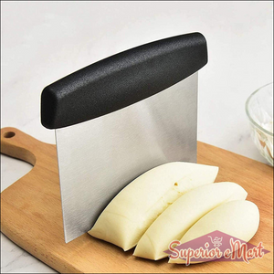 Superior eMart stainless steel dough scraper on a wooden cutting board with sliced dough