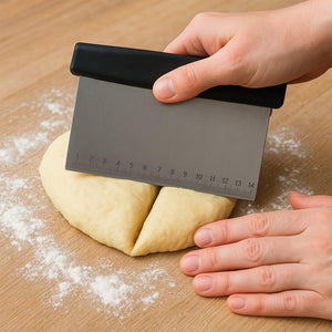 Superior eMart stainless steel dough scraper cutting dough with a comfortable grip handle