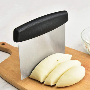 Superior eMart stainless steel dough scraper on a wooden cutting board with sliced dough