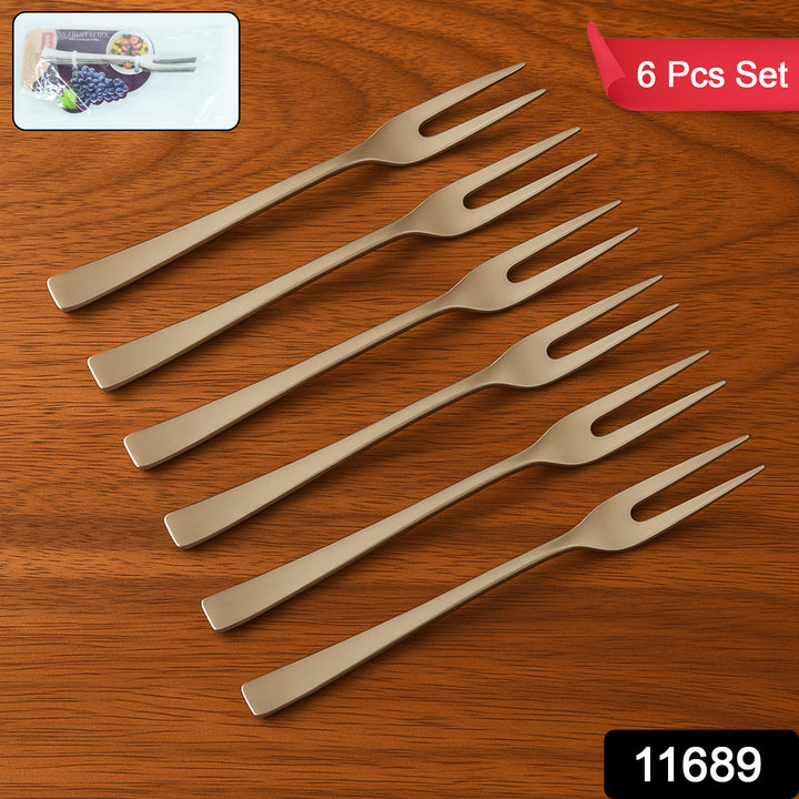 Superior eMart stainless steel fruit fork set with six sleek, two-prong forks on wooden surface